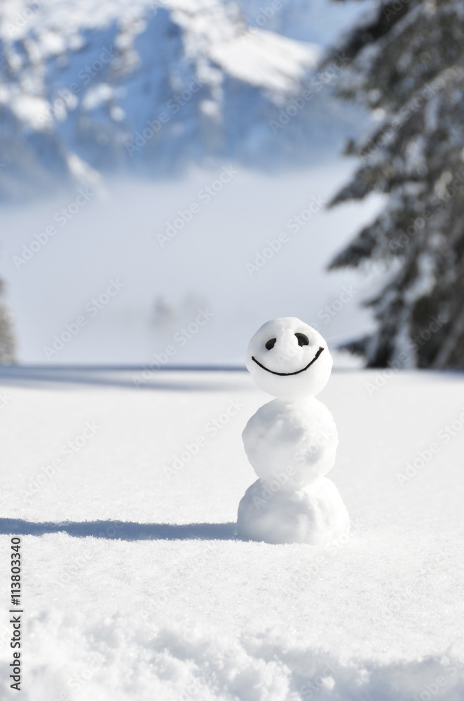 Snowman against Alpine scenery