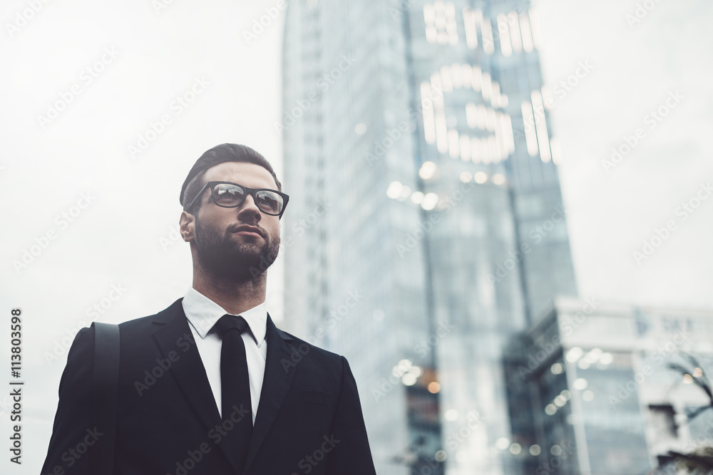 Fototapeta premium Businessman in city. 