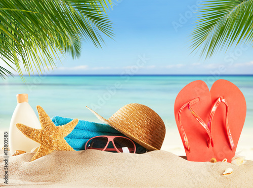 Fototapeta Naklejka Na Ścianę i Meble -  Summer beach accessories on sand