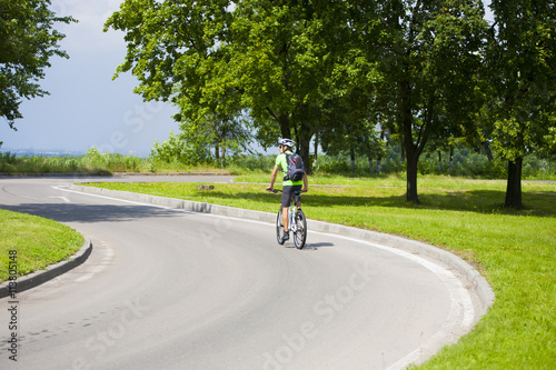 Wallpaper Mural A man on a Bicycle with a backpack. Torontodigital.ca