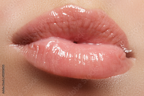 Perfect smile. Beautiful full pink lips. Pink lipstick. Gloss lips. Make-up & Cosmetics