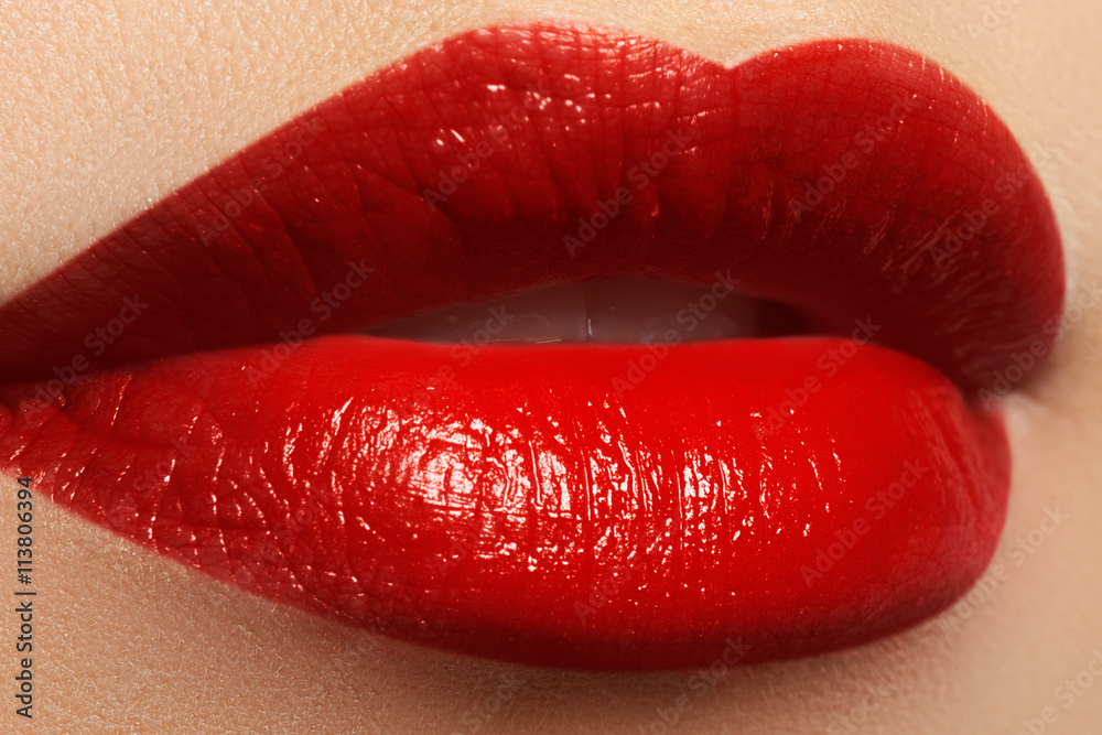 Obraz premium Close-up shot of woman lips with red lipstick. Beautiful perfect lips. Sexy mouth close up. Beautiful wide smile of young fresh woman with full lips