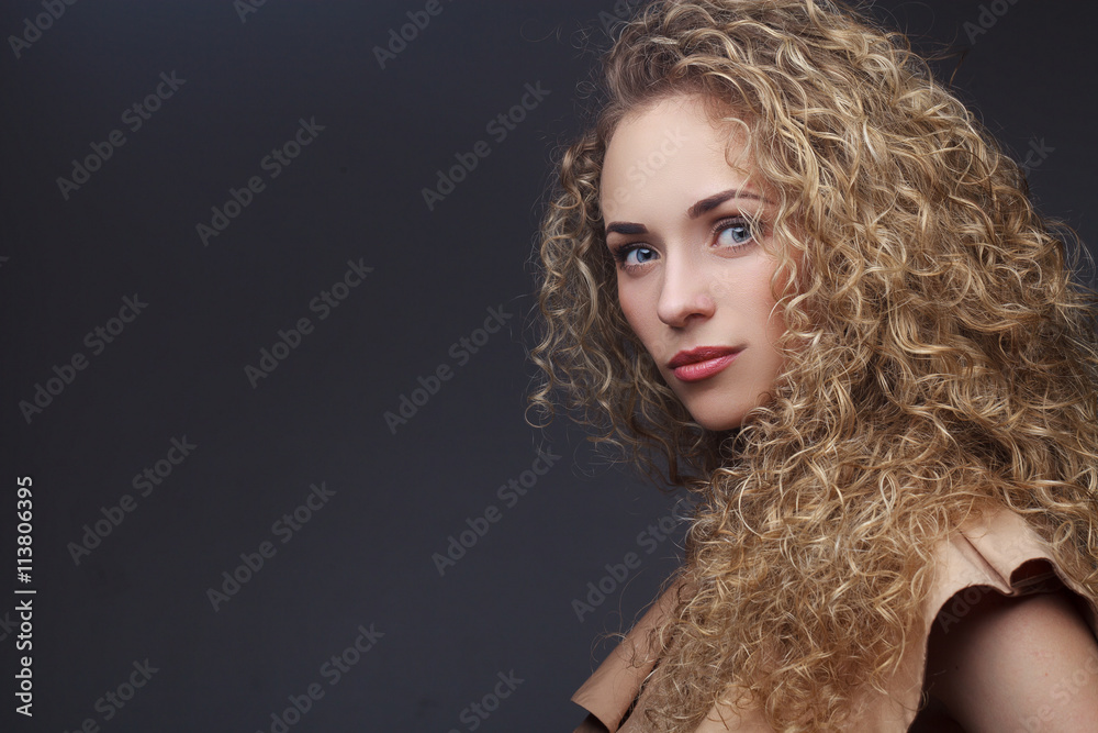 Portrait of perfect woman with curly hair