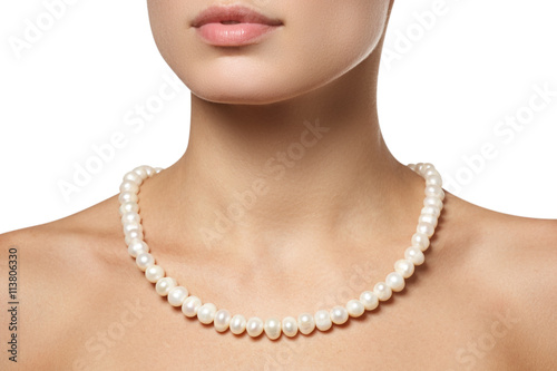 Fototapeta Beautiful fashion pearls necklace on the neck