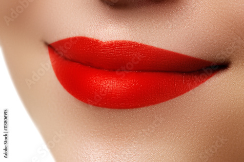Woman s lips with red lipstick. Beauty and fashion