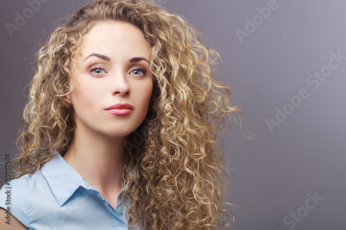 Portrait of perfect woman with curly hair