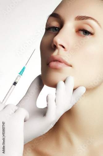 Portrait of young  woman getting cosmetic injection