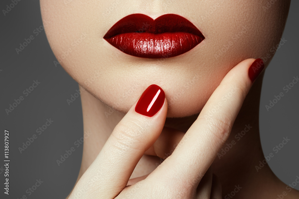 Naklejka premium Red sexy lips and nails closeup. Open mouth. Manicure and make-up