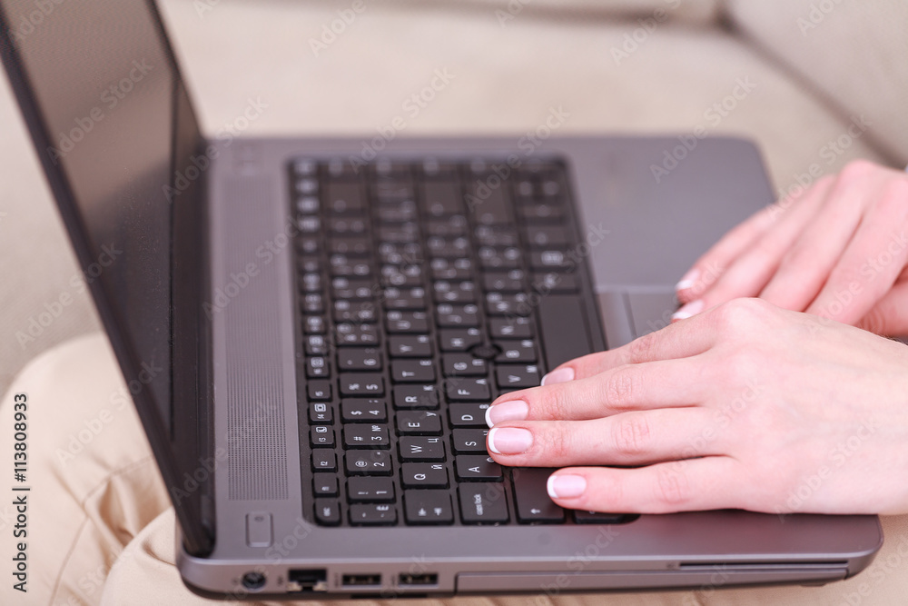 Woman typing on keyboard Woman typing on keyboard