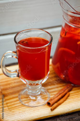 Fresh cold strawberry tea with ice and cinnamon