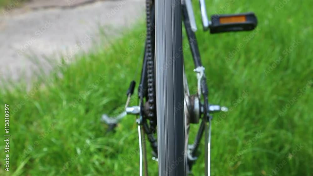 Man inspecting old bike produced in about 1970. Details of vintage bike. Bicycle is old, rusty and in bad condition. Close up of turning wheel. Problem with old wheel. Man inspecting old bike produced in about 1970. Details of vintage bike. Bicycle is old, rusty and in bad condition. Close up of turning wheel. Problem with old wheel.