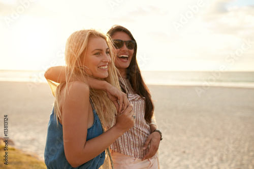 Best friends enjoying summer vacation on beach photo