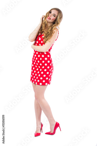 Blonde sexy girl in a red dress with beautiful hair Portrait in full growth on a white background. © redfox331