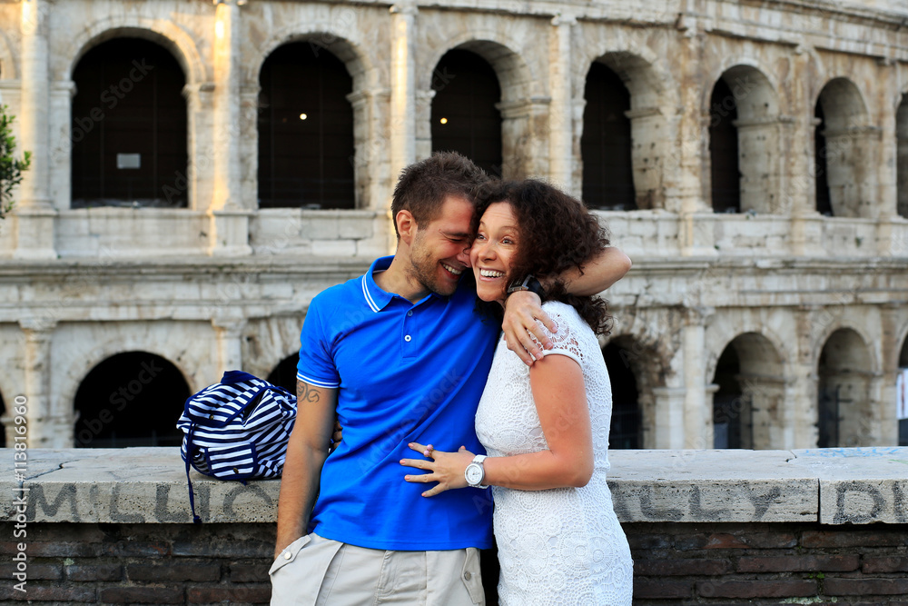 Young couple on the background of the Colosseum, Rome