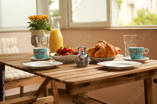 Konstfotografi Beautifully arranged table on a sunny terrace