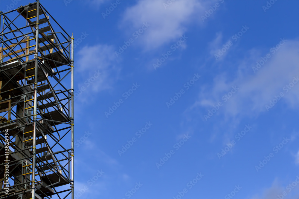 Scaffolding element. Blue sky background. Construction and reconstruction concept Scaffolding element. Blue sky background. Construction and reconstruction concept