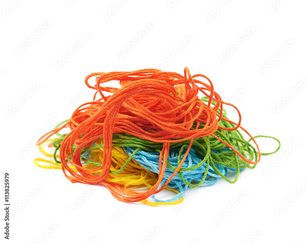 Mixed pile of yarn threads isolated
