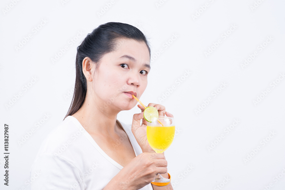 Woman drinking lemonad. Healthy food . Skin care and beauty. On Woman drinking lemonad. Healthy food . Skin care and beauty. On