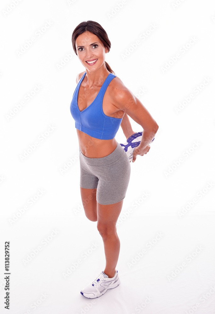 Stretching brunette woman on white backgound Stretching brunette woman on white backgound