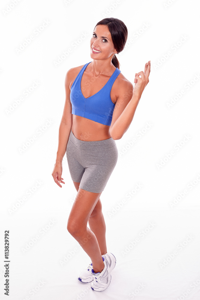 Happy smiling brunette crossing her fingers Happy smiling brunette crossing her fingers