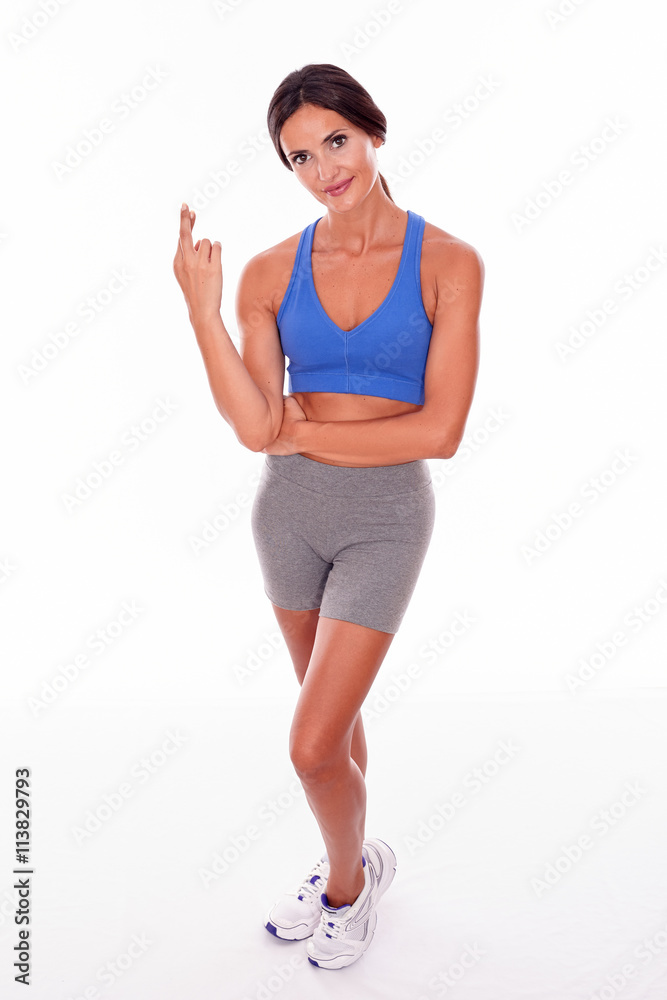 Happy smiling brunette crossing her fingers Happy smiling brunette crossing her fingers