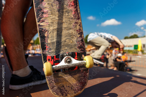 Competitions for skateboarding and scratched skateboard.