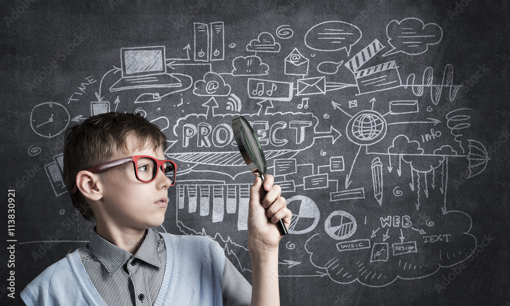Curious school boy with magnifier Curious school boy with magnifier
