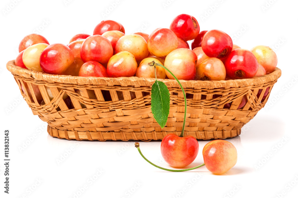 yellow cherries in a wicker basket isolated on white background yellow cherries in a wicker basket isolated on white background