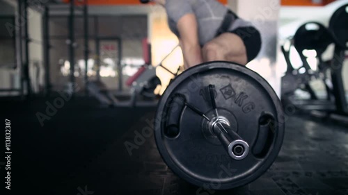 Young Male Athlete Exercising With A Barbell. Deadlifts