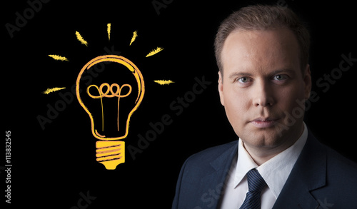 portrait of a man with an idea on a black background