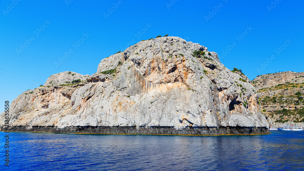 beautiful bay and rocks view from sea Rhodes Greece sunny day