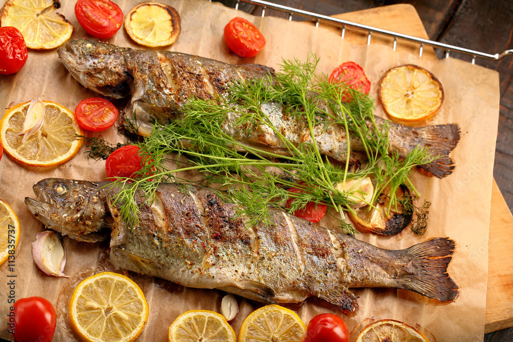 Whole baked fish on the grill