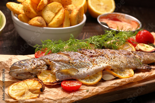 Baked fish with roasted potatoes and dip