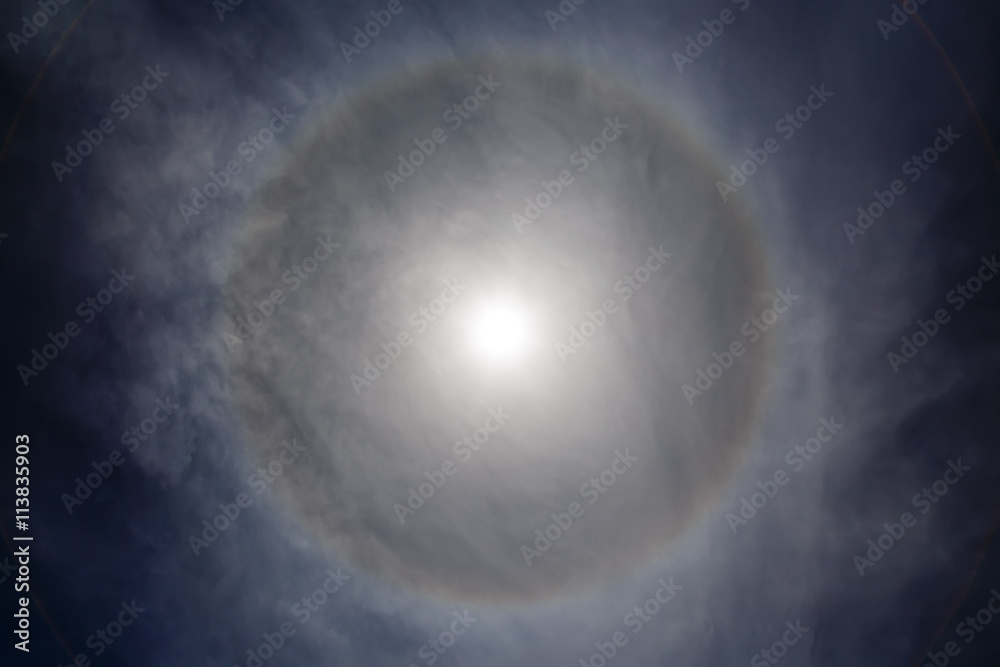 halo effect around the sun, day of clouds unusual halo effect around the sun, day of clouds unusual