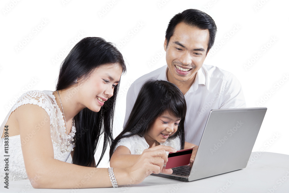 Family shopping online with notebook computer