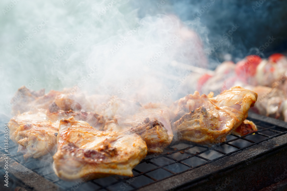 Chicken legs being fried on grill Chicken legs being fried on grill