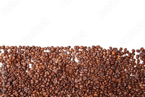 Brown roasted coffee beans isolated on white background