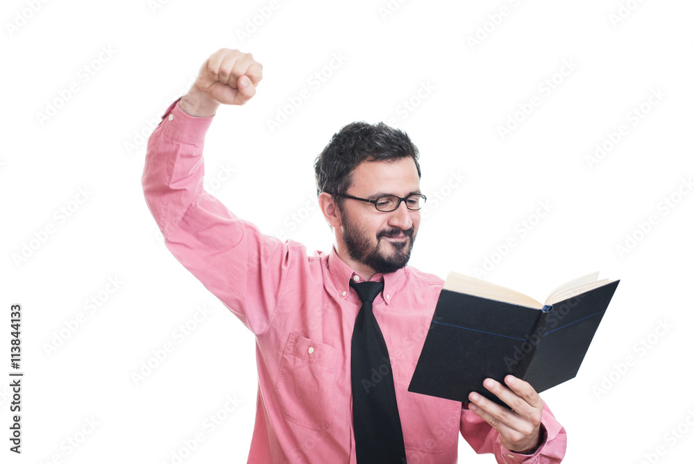 Young man reading a book and smiling Young man reading a book and smiling