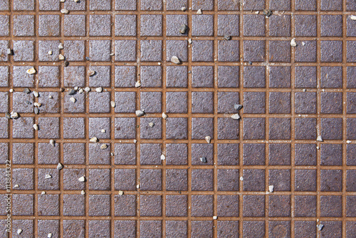 old brown rusty metallic textured surface with lots of small pebbles