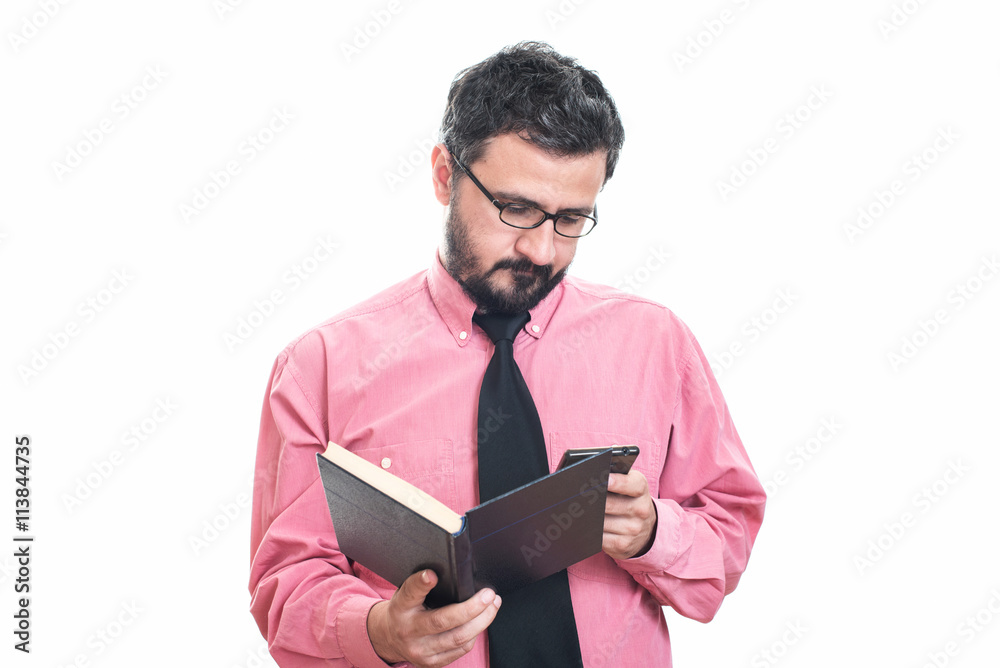 Young man check grammar mistake of a book Young man check grammar mistake of a book