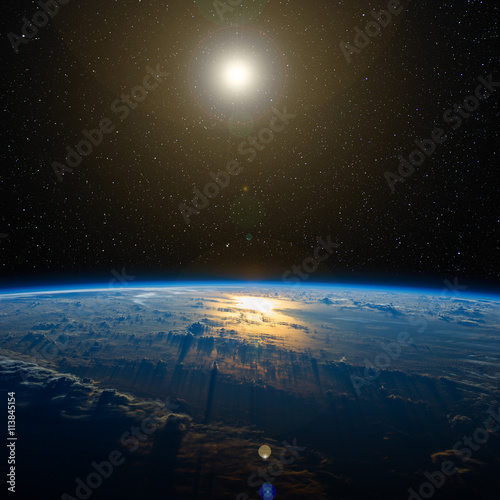 Fototapeta Naklejka Na Ścianę i Meble -  Sunlight reflects off the ocean from space. Includes NASA data.