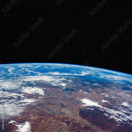 Fototapeta Naklejka Na Ścianę i Meble -  Eastern Australia from space with stars above. Includes NASA data.