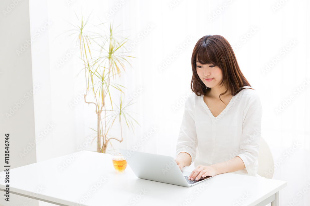 attractive asian woman using laptop computer attractive asian woman using laptop computer