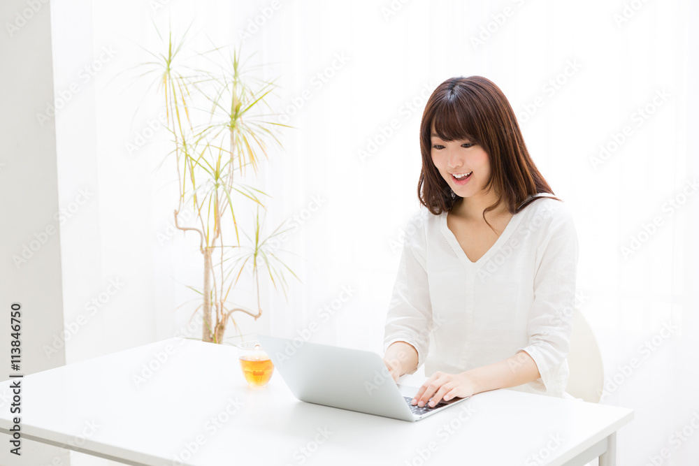 attractive asian woman using laptop computer attractive asian woman using laptop computer