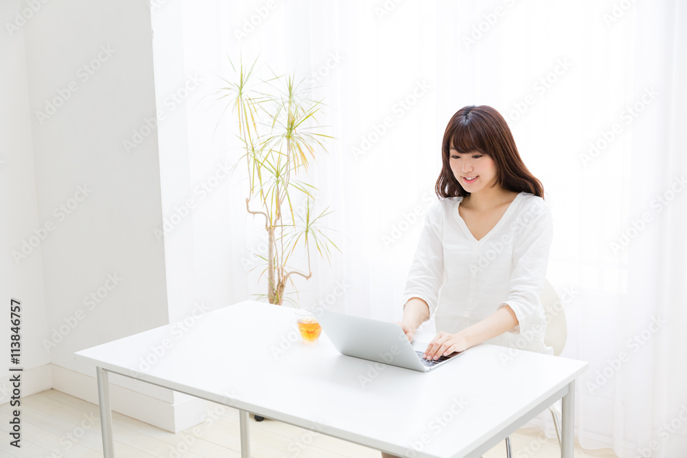 attractive asian woman using laptop computer attractive asian woman using laptop computer