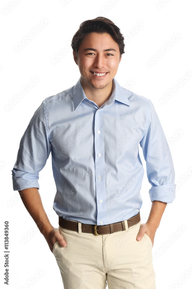 A calm relaxed man wearing a light blue shirt with beige pants, standing  against a white background with a big toothy smile. Carefree and relaxed  looking at camera. Stock Photo | Adobe