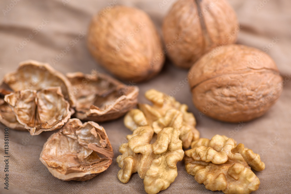 Walnut without shell close-up, and nuts in the shell Walnut without shell close-up, and nuts in the shell