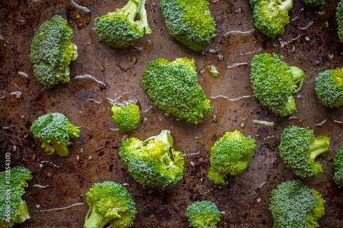 Broccoli florets on cooking pan with olive oil for recipe