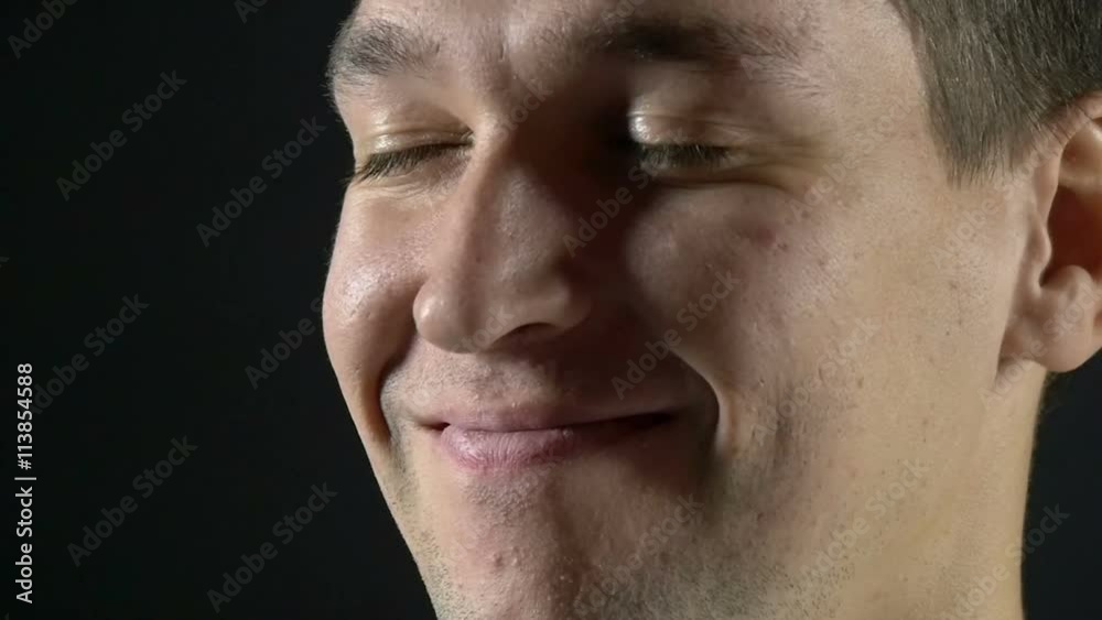 Portrait of a cheerful and smiling man, slow motion Portrait of a cheerful and smiling man, slow motion