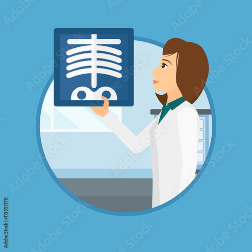 Doctor examining radiograph.